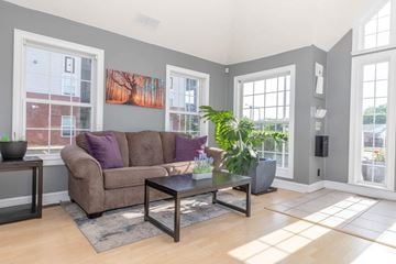 Lafayette apartment for rent - A living room with a brown couch and a coffee table.