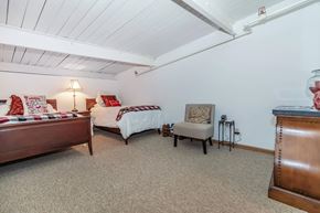 Lafayette apartment for rent - A bedroom with two beds and a chair.