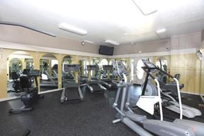 West Lafayette apartment for rent - A gym with a variety of equipment including treadmills, elliptical machines, and weights.