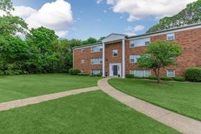 West Lafayette apartment for rent - A red brick building with a white door and windows.