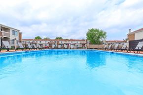 West Lafayette apartment for rent - A large swimming pool with a blue tinted water.