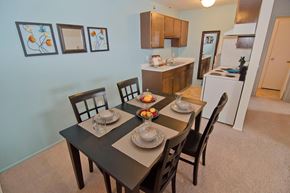 Lansing townhouse for rent - A dining room with a table set for two.