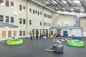 Bloomington apartment for rent - A gym with a variety of equipment including treadmills, weights, and exercise bikes.