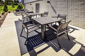 Bloomington apartment for rent - A set of outdoor furniture is arranged on a patio.