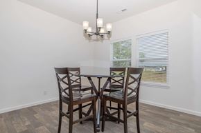 Lafayette apartment for rent - A dining room with a table and chairs.