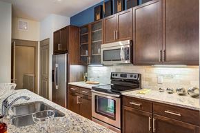 Houston apartment for rent - a kitchen with stainless steel appliances and granite counter tops