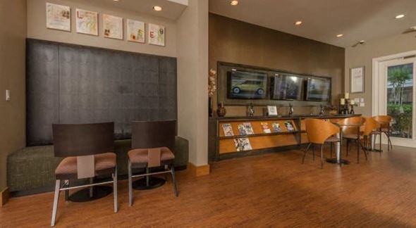 Houston apartment for rent - a living room with a table and chairs and a bar
