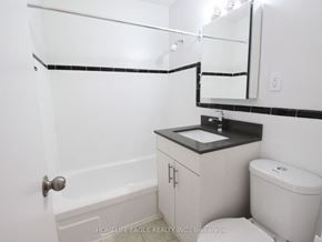 Toronto apartment for rent - a bathroom with a sink and a toilet and a bath tub