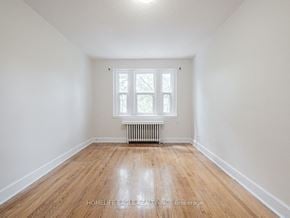 Toronto apartment for rent - a empty room with wood floors and a window