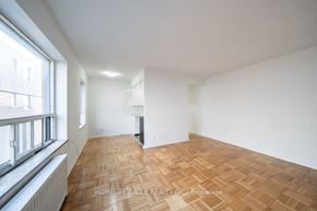 Toronto apartment for rent - a living room with a wood floor and a window