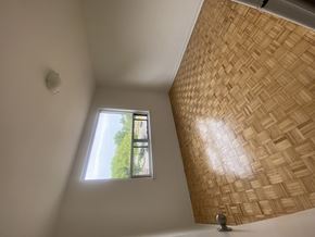 Toronto apartment for rent - a small window in a room with a high ceiling
