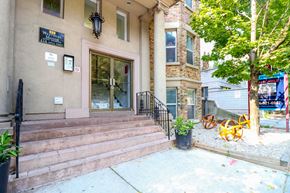 Toronto apartment for rent - the front of a building with stairs and a glass door