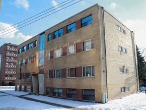 Burlington apartment for rent - a brick building with some snow in front of it