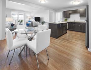 Edmonton apartment for rent - a kitchen and dining room with a table and chairs