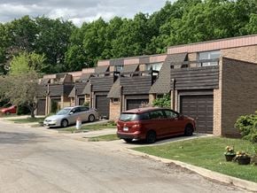 Oakville apartment for rent - a row of houses with cars parked in front of them