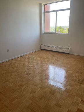 Toronto apartment for rent - an empty room with a window and a radiator