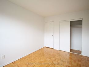 Burlington apartment for rent - an empty room with white walls and wooden floors and a closet