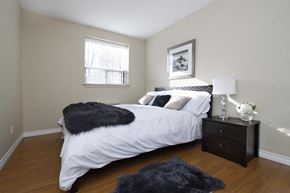 Hamilton apartment for rent - a bedroom with a white bed and a window