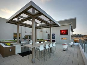 San Diego apartment for rent - A modern outdoor kitchen with a dining table and chairs at West Park Apartments, San Diego, 92108