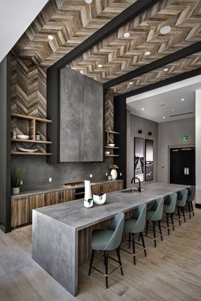 San Diego apartment for rent - A modern kitchen with a long island and chairs at Purl Apartments, San Diego