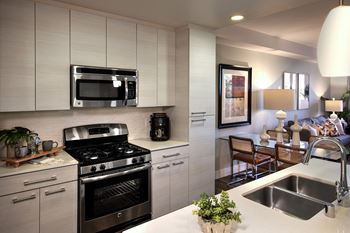 Custom tile or glass backsplash accents in kitchen