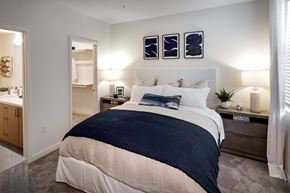 Oceanside apartment for rent - a bedroom with a bed and a bathroom at Luma at El Corazon Apartments, California 92056