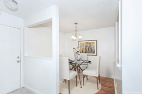 Madison apartment for rent - a dining room with a glass table and white chairs
