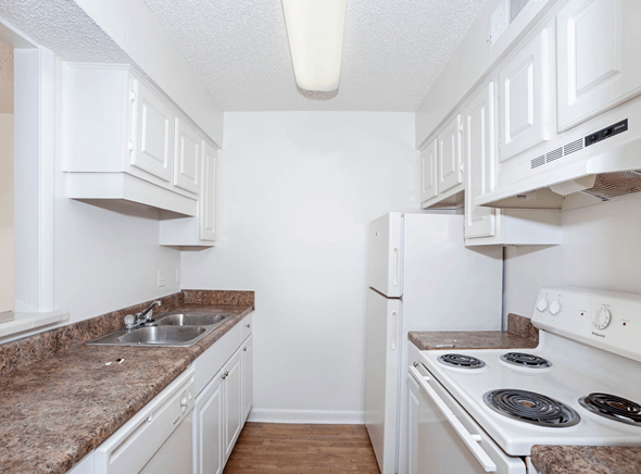 Madison apartment for rent - a kitchen with white appliances and white cabinets