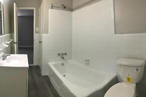 Philadelphia apartment for rent - a small bathroom with a tub and a toilet and a sink