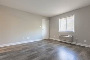 Charlotte apartment for rent - the living room of a house with wood floors and a window