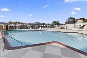 Philadelphia apartment for rent - A large outdoor swimming pool with a red and white checkered floor.