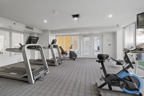 Philadelphia apartment for rent - A gym with treadmills, exercise bikes, and a television.