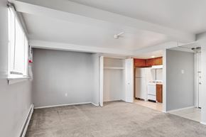 Philadelphia apartment for rent - A spacious living room with a kitchen in the background.