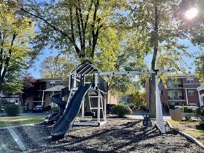 Feasterville-Trevose apartment for rent - A playground with a slide and a swing set.