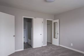 Philadelphia apartment for rent - A room with a grey carpet and three doors.