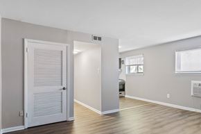 Philadelphia apartment for rent - A room with a white door and a window with blinds.