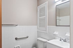Philadelphia apartment for rent - A white toilet sits next to a sink in a bathroom.