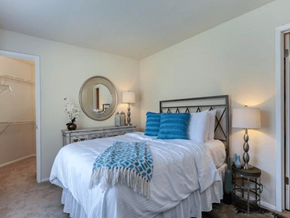 Madison apartment for rent - a bedroom with a white bed and a mirror