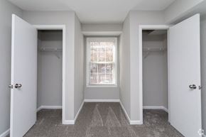 Greensboro apartment for rent - an empty bedroom with two closets and a window