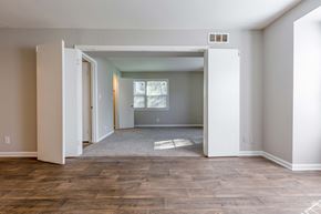 Greensboro apartment for rent - an empty living room with a door open to a bedroom