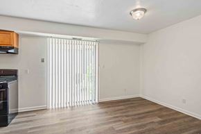 Norfolk apartment for rent - A room with wooden flooring and a window with blinds.
