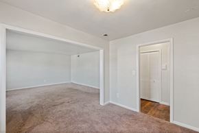 Pikesville apartment for rent - an empty bedroom with a closet and a door to the bathroom