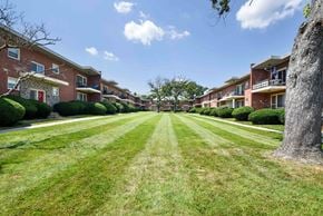 Pikesville apartment for rent - a large lawn in front of an apartment building