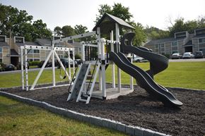 High Point apartment for rent - a playground with a slide in a park