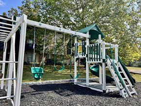 Madison apartment for rent - a playground with a swing set and a play house