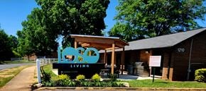 Charlotte apartment for rent - A building with a sign that says "LOVE LIVING" in front of it.