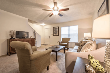 Batavia apartment for rent - A living room with a brown chair and a brown coffee table.