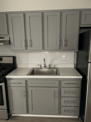 Philadelphia apartment for rent - a small kitchen with a sink and cabinets