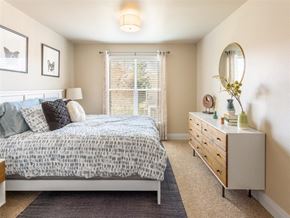 Seattle apartment for rent - a bedroom with a bed and a dresser