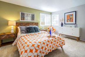 Seattle apartment for rent - a bedroom with a bed and two windows